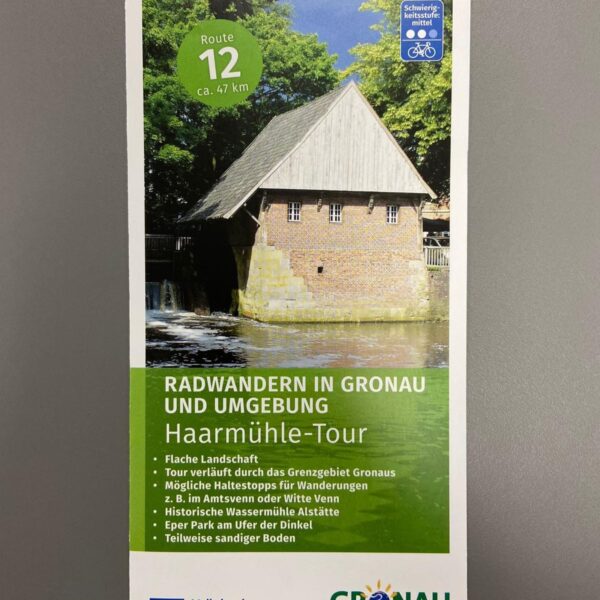 Vorderseite des Radwanderflyers Haarmühle-Tour mit einem Bild der historischen Wassermühle
