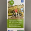 Vorderseite des Radwanderflyers "Bad Bentheim-Tour". Zu sehen sind zwei Radfahrer vor der Burg.